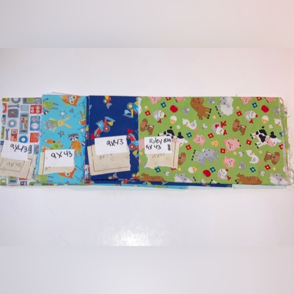 4 Novelty pieces of children’s fabric fat quarters  each 9 inches x 43 inches